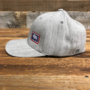 Bison Flag Flex Fit | Hats  The WyoMade Bison Flag Trucker Hat is a favorite design from WyoMade Apparel!   The Bison represents freedom and is a staple of Wyoming's open spaces. This Bison Flag Flex Fit Hat is sure to appease your desire to roam free.  Be a part of the herd in a Bison Flag Flex Fit Hat.  Offering sizes ranging from: Small / Medium Large / XL WyoMade is a Wyoming Craft Apparel brand located in the heart of Downtown Casper, Wyoming. 