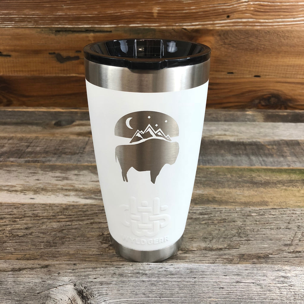 Bison Moon Tumbler | 20 oz | White The WyoMade Bison Moon Tumbler is pure beverage containment for 20 ounces of your favorite hot or cold drink.  It comes with a smooth-flow sippy-lid for direct beverage enjoyment.  This White colored Tumbler is designed for any Wyoming lifestyle and will surely allow you to roam free with your favorite beverage.  Bring some life to the herd with a Bison Moon Tumbler from WyoMade.