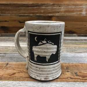 WyoMade | Bison Moon Coffee Mug | Ceramic The New Bison Moon is a modern twist on our long time iconic design from WyoMade!   The Bison represents freedom and is a staple of Wyoming's open spaces. This Wyoming Made ceramic coffee mug is sure to appease your desire to roam free.  Be a part of the herd with a Bison Moon Coffee Mug.