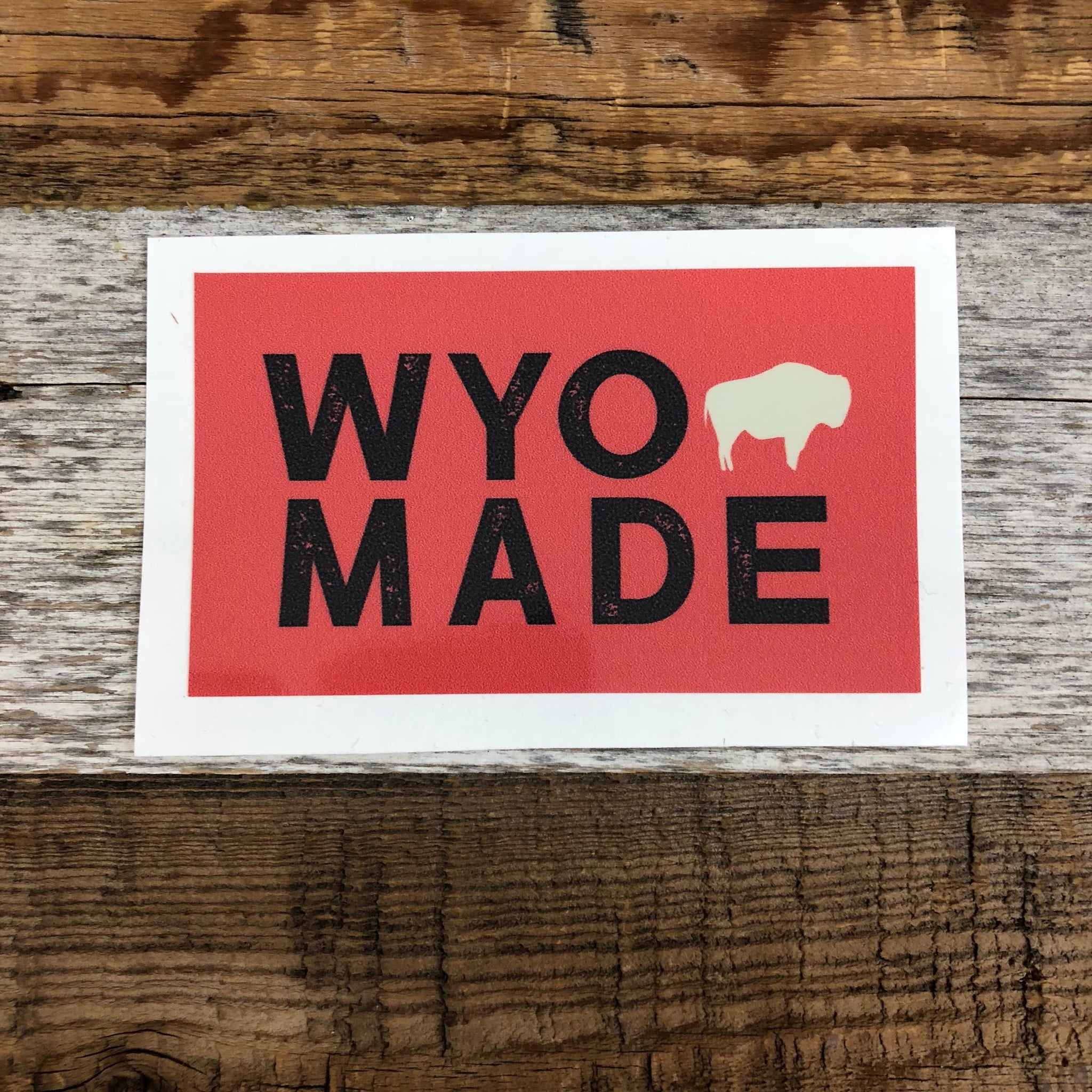 The New Bison Moon is a modern twist on our long time iconic design from WyoMade!   The Bison represents freedom and is a staple of Wyoming's open spaces. This sticker is sure to appease your desire to roam free.  Be a part of the herd with the WyoMade Tag Logo Sticker from Wyomade.     Size:  2.4" x 4"