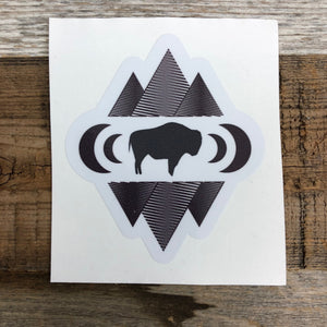 The New Bison Moon is a modern twist on our long time iconic design from WyoMade!   The Bison represents freedom and is a staple of Wyoming's open spaces. This sticker is sure to appease your desire to roam free.  Be a part of the herd with the Geo Bison Sticker from Wyomade.     Size:  3" x 3.5"